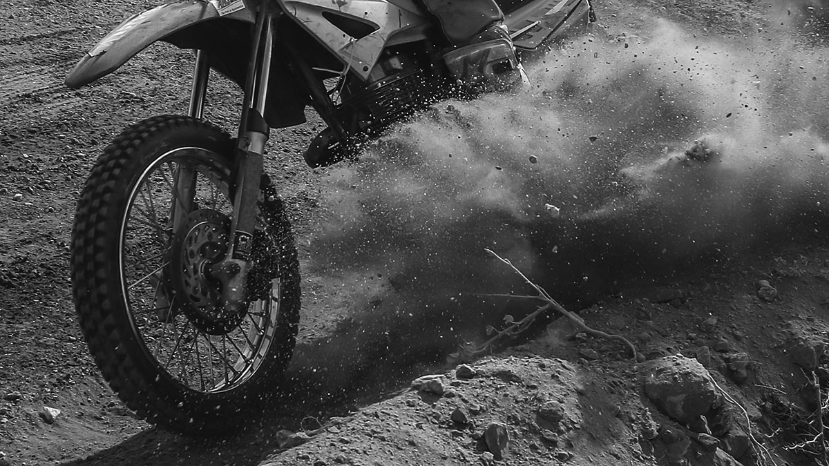 wheel of dirt bike on sand